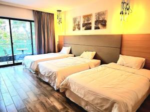 Ένα ή περισσότερα κρεβάτια σε δωμάτιο στο CHILCHILL Hotel Riverside