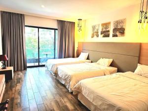 Postel nebo postele na pokoji v ubytování CHILCHILL Hotel Riverside