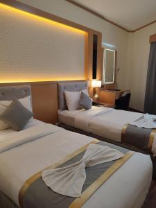 Postel nebo postele na pokoji v ubytování York International Hotel