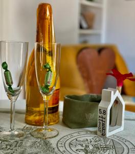 a table with two glasses and a bottle of wine at Alloggio Turistico San Valentino 5,8 in Poggio Mirteto