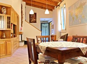 a dining room with a table and chairs at Ca' Usignolo in San Ruffillo +4 photos