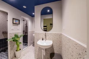 a bathroom with a sink and a mirror at Bluewaters Female-Only Hostel in Singapore +32 photos