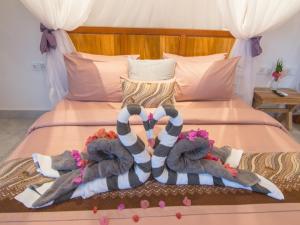 Posteľ alebo postele v izbe v ubytovaní CoCo Breeze Spa Hotel