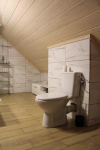 a bathroom with a toilet in a room at Siedlisko Magiczne Cimanie in Cimanie +70 photos
