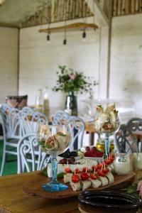 a table with two wine glasses and food on it at Siedlisko Magiczne Cimanie in Cimanie