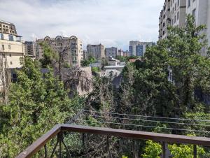 a stairway in a city with tall buildings at Moonflower residence 4645 in Bishkek