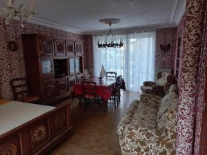 a living room with a couch and a table at Maison du Port Du Goyen in Audierne