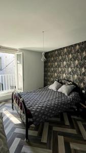 Ένα ή περισσότερα κρεβάτια σε δωμάτιο στο Appartement pour 5 voyageurs