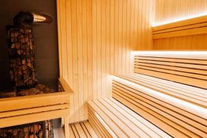 a sauna with wood paneling and aperature at Milli&Jon SPA in Bukovel +25 photos