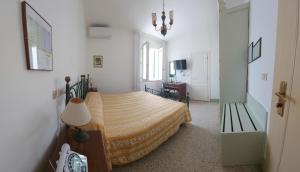 Postel nebo postele na pokoji v ubytování Albergo Regina