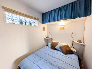 Posteľ alebo postele v izbe v ubytovaní MARSEILLAN-PLAGE - Studio climatisé avec coin nuit séparé - Terrasse & parking privé