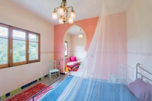 a bedroom with a bed with a canopy and a mirror at Casa Luna in Prunetto +25 photos
