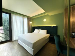 Postel nebo postele na pokoji v ubytování Design Hotel & Private Spa - Tbilisi Edition