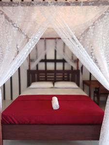 Tempat tidur dalam kamar di Alen's Stay&surf