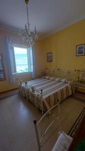 Postel nebo postele na pokoji v ubytování Albergo Regina
