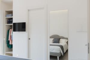 Postel nebo postele na pokoji v ubytování MIFRA SUITES