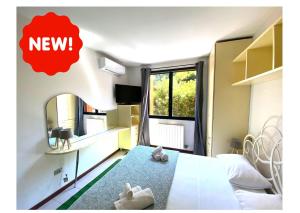 A kitchen or kitchenette at Desenzanoloft Official Partner MARRIOTT Homes & Villas - Dolce vita with Garden and Pools