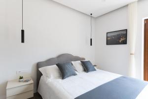 Postel nebo postele na pokoji v ubytování MIFRA SUITES