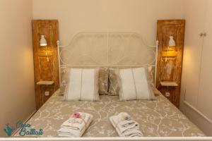 En eller flere senge i et værelse på Casa Battiati