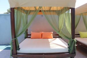 a bed in a room with a canopy at Holiday Park Verse in Ulcinj