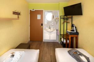 TV a/nebo společenská místnost v ubytování Jupiter Hotel