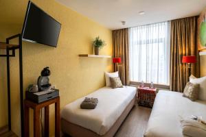 TV a/nebo společenská místnost v ubytování Jupiter Hotel