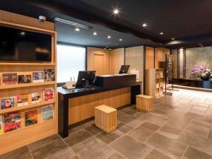 a lobby of a store with a cashier and a counter at Comfort Inn Kyoto Shijokarasuma in Kyoto