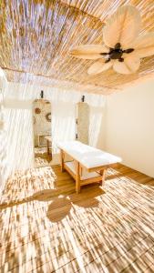 A bed or beds in a room at Ayvalık Sea Resort