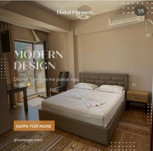 a bedroom with a bed in a room with aperature at Hotel Permeti in Përmet