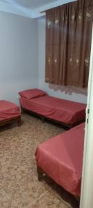 Ένα ή περισσότερα κρεβάτια σε δωμάτιο στο Résidence badis