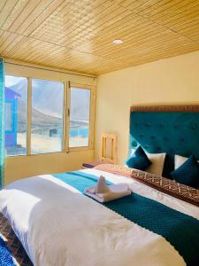 Voodi või voodid majutusasutuse Oasis Retreat Pangong toas