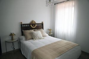 En eller flere senge i et værelse på A Calzada