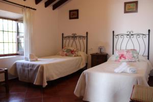 En eller flere senge i et værelse på Casa Rural Bellavista + 54 billeder