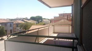 a balcony with a view of a street and buildings at Casa Luciano Bellaria Centro in Bellaria-Igea Marina