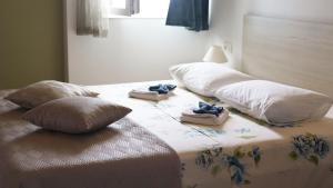 Postel nebo postele na pokoji v ubytování Guesthouse Miranda NP Krka