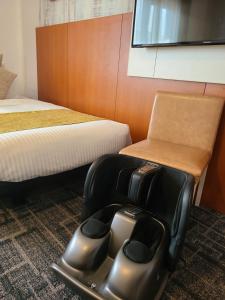 Postel nebo postele na pokoji v ubytování HOTEL MYSTAYS Maihama