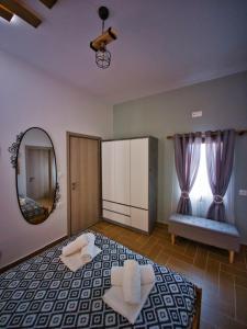 Postel nebo postele na pokoji v ubytování West Crete House