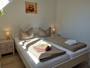Ένα ή περισσότερα κρεβάτια σε δωμάτιο στο Ferienhaus Papstdorf Sächsische Schweiz 16