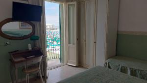 Postel nebo postele na pokoji v ubytování Albergo Regina
