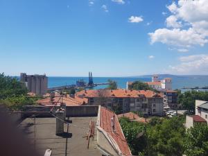a view of a city with buildings and the ocean at Guest Rooms Radost in Balchik