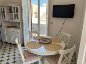 A television and/or entertainment centre at Villa Bianca, Seaside panoramic Rooftop