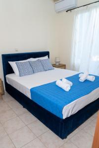 A bed or beds in a room at Mastiha luxury maisonette I
