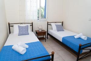 A bed or beds in a room at Mastiha luxury maisonette I