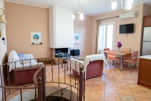A television and/or entertainment centre at Mastiha luxury maisonette I