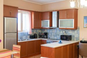 A kitchen or kitchenette at Mastiha luxury maisonette I