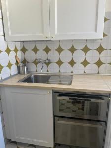 A kitchen or kitchenette at Villa Bianca, Seaside panoramic Rooftop