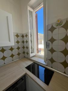 A kitchen or kitchenette at Villa Bianca, Seaside panoramic Rooftop