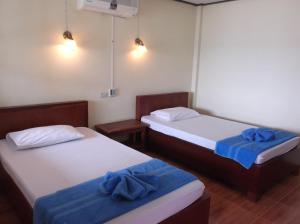 Postel nebo postele na pokoji v ubytování Lamai Resort
