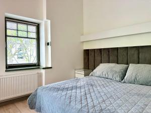 Posteľ alebo postele v izbe v ubytovaní Evergreen Sopot House