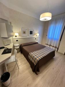 Postel nebo postele na pokoji v ubytování Hotel La Pace